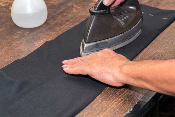 Carefully iron the legs of the pants